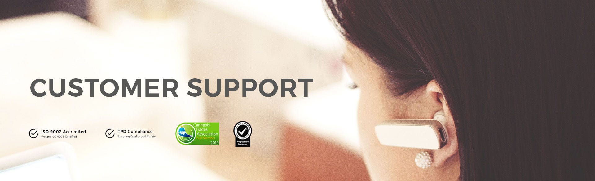 Photo of a woman with an earpiece featuring the title Customer Support and approval badges