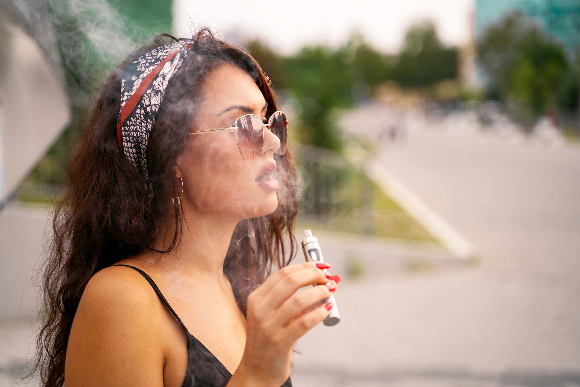 Women using an e-cigarette to vape (Image)